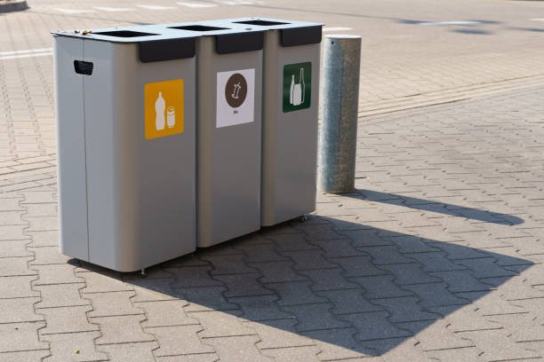 sorting garbage into different containers. caring for the environment.